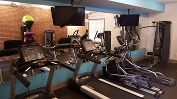 Cardio Machines In Gym at Monroe Place Apartments, Atlanta, Georgia
